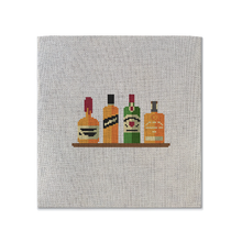Load image into Gallery viewer, Needlepoint canvas with a design of four whiskey bottles as the needlepoint pattern on it