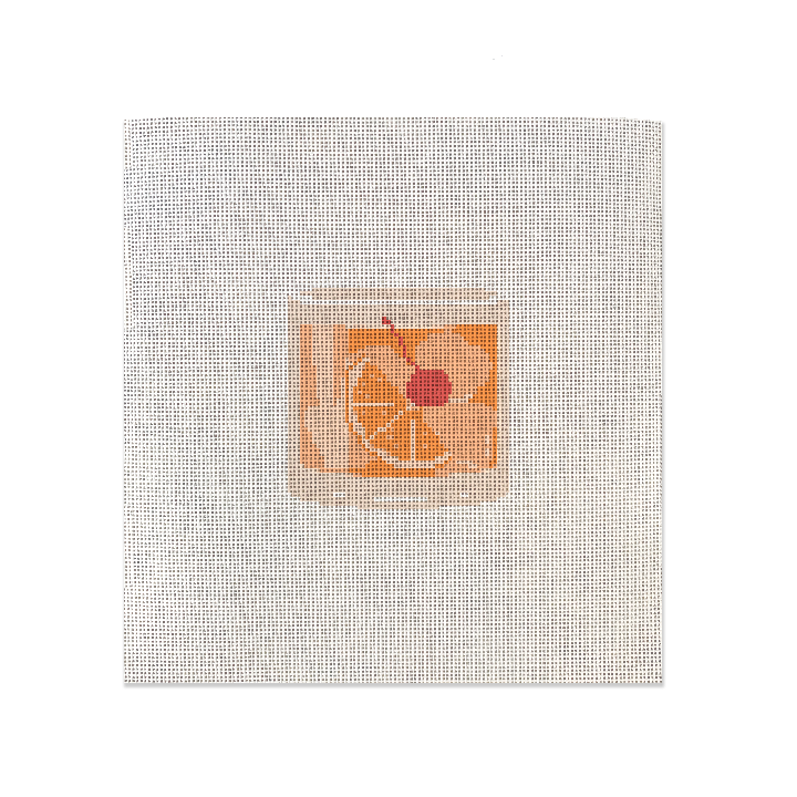 A whiskey themed needlepoint canvas with an old fashioned drink design on it